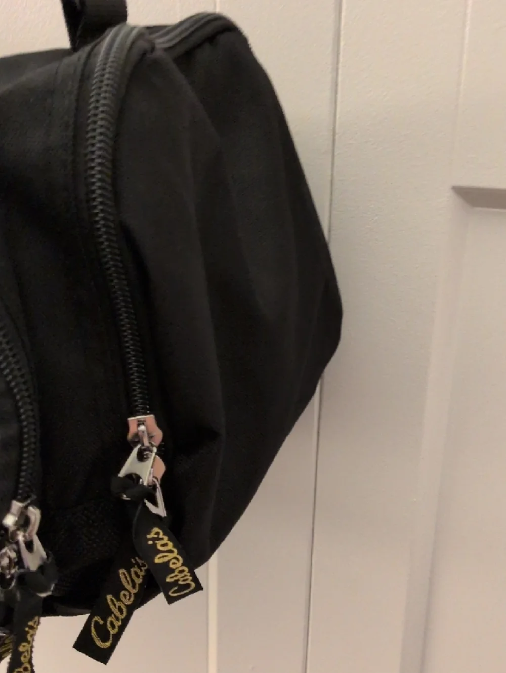 Cabela's Black Duffel Bag with Gold Logo and Adjustable Strap
